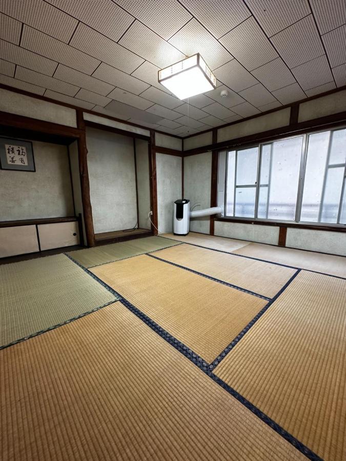 素泊まり民宿とみや Oshima Bagian luar foto