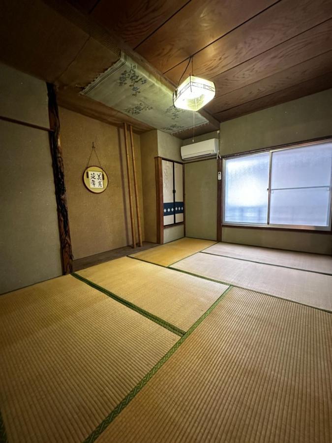 素泊まり民宿とみや Oshima Bagian luar foto